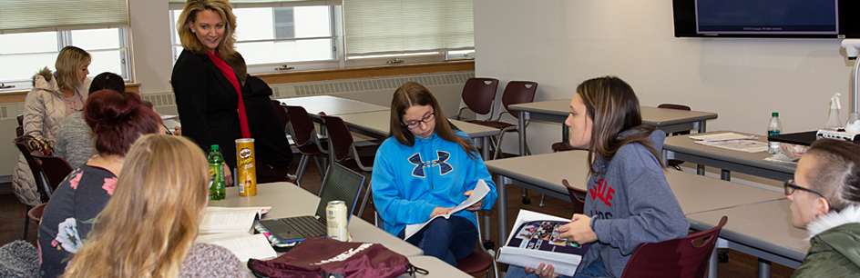 Instructor speaking to students in class