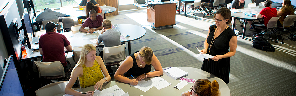 math professor working with students